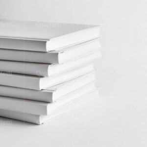 A stack of books with minimal color palette of white and gray.